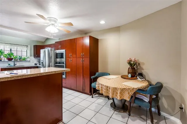 a dining room with furniture and window
