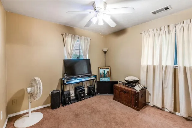 a room with furniture and a flat screen tv