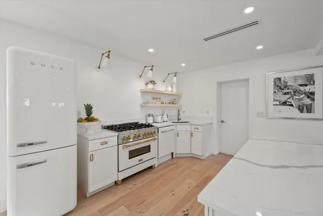 a kitchen with a stove and cabinets