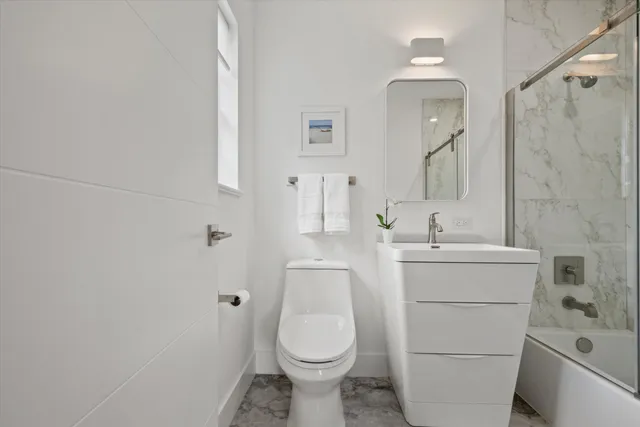 a view of a chair and table in backyard