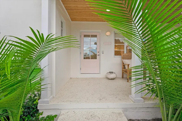 a view of a house with a yard and plants