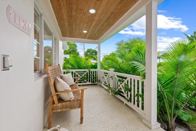 a view of balcony with furniture