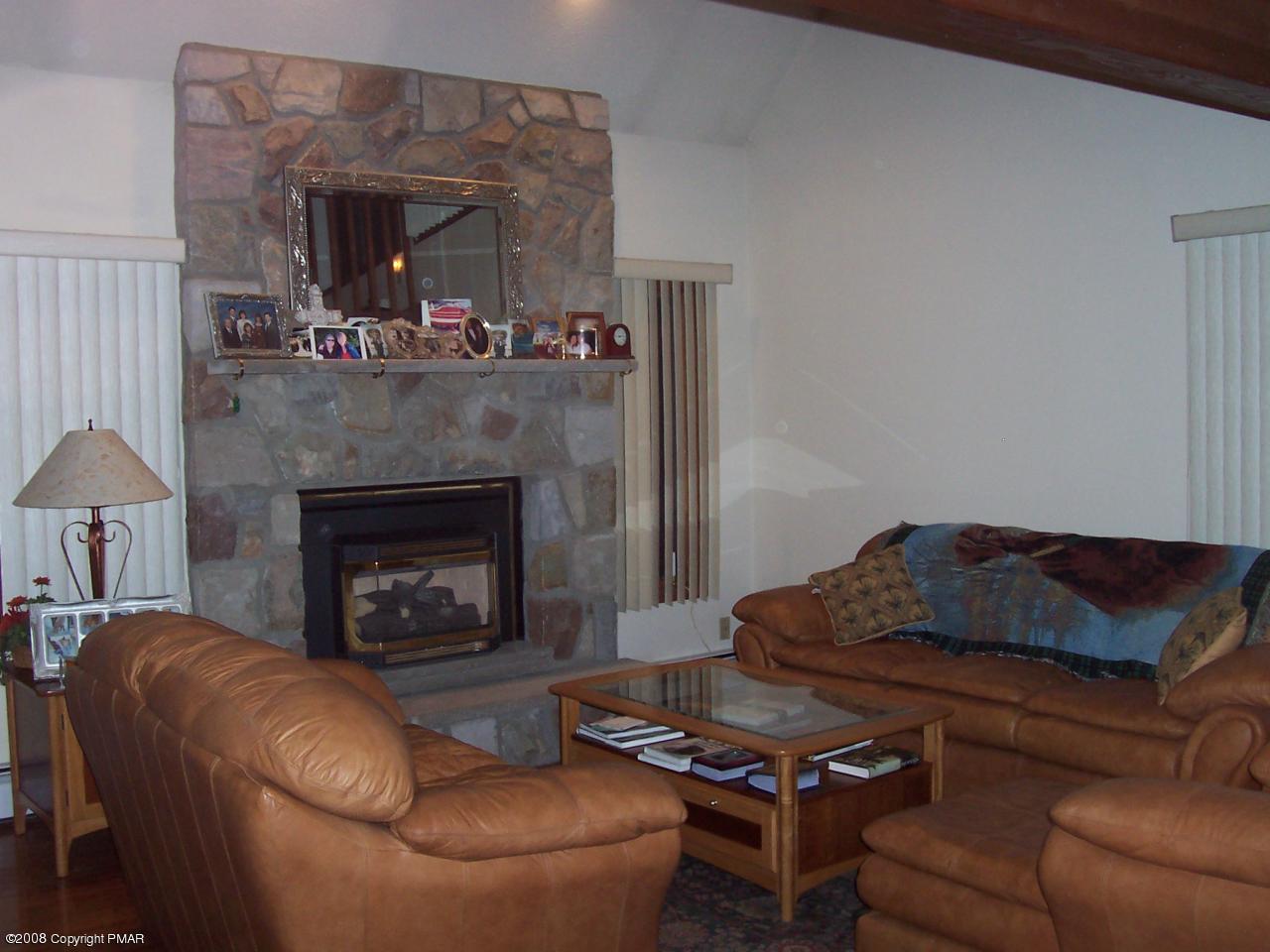 29 Hemlock Road Blakeslee, PA 18610 - Photo 3 of 7 a living room with furniture and a fireplace