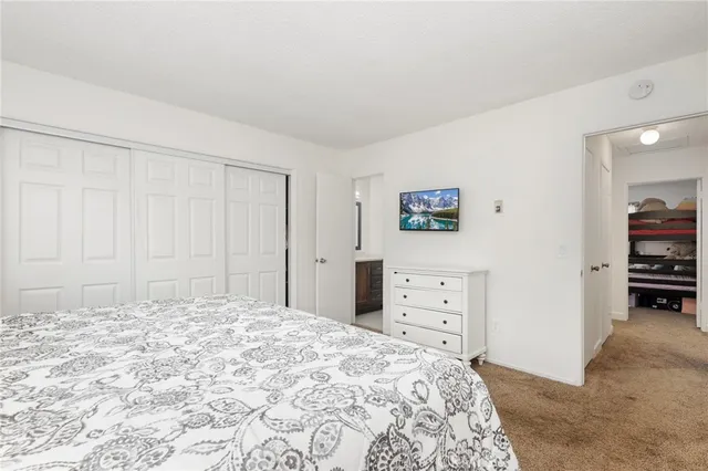 a bedroom with a bed and a cabinets