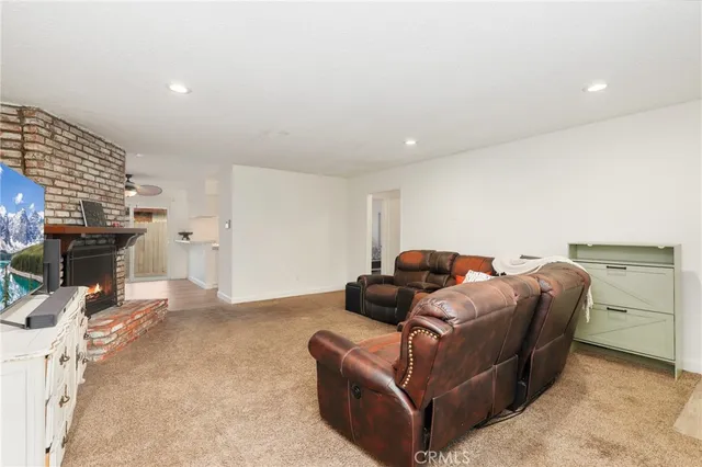 a bedroom with furniture and a fireplace