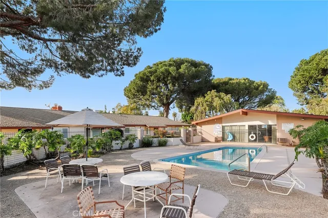 a front view of a residential apartment building with a yard