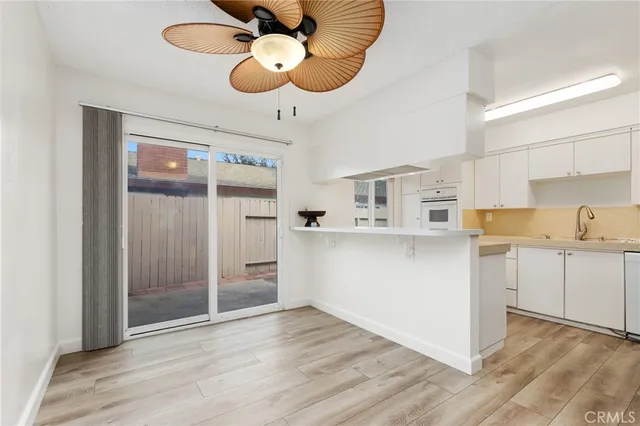 a view of a kitchen with electric appliances