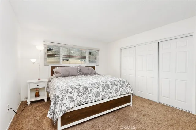 a room with a bed and a window