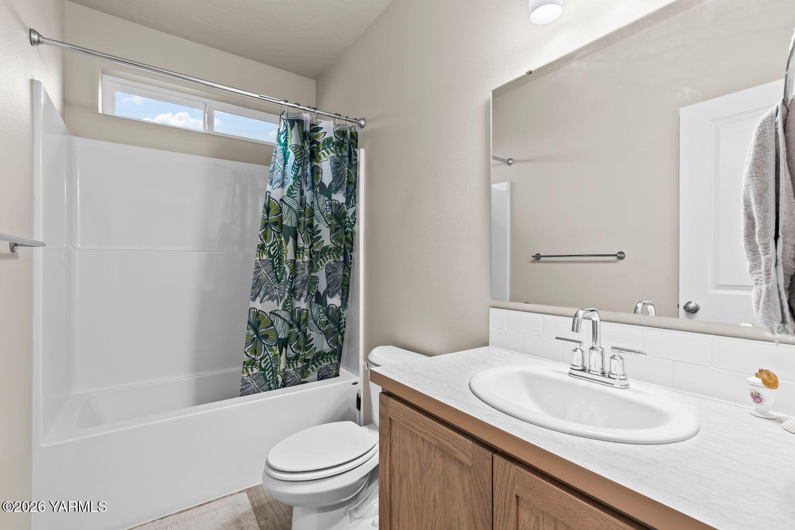 403 Lambert Court Grandview, WA 98930 - Photo 13 of 27 a bathroom with a sink toilet and shower