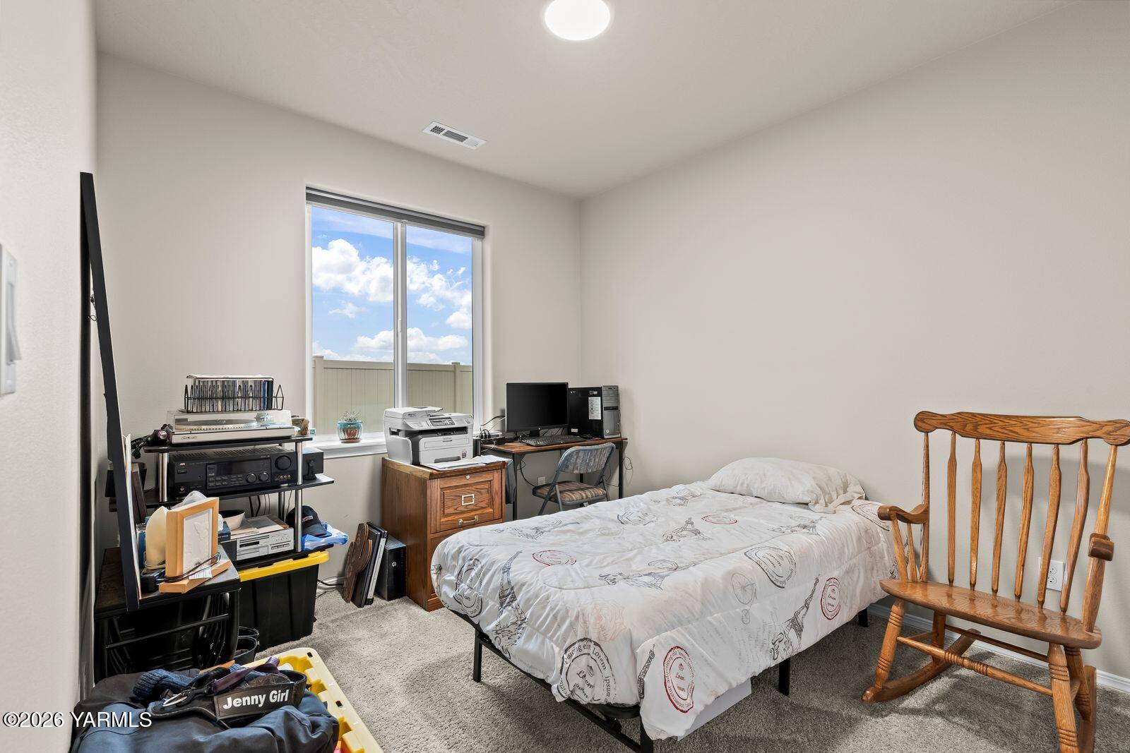 403 Lambert Court Grandview, WA 98930 - Photo 14 of 27 a bedroom with a bed and a couch
