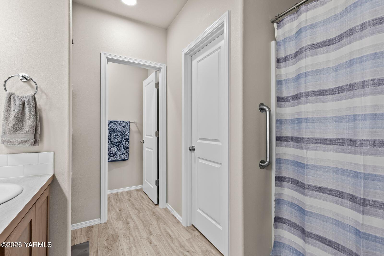 403 Lambert Court Grandview, WA 98930 - Photo 20 of 27 a bathroom with a shower and a sink