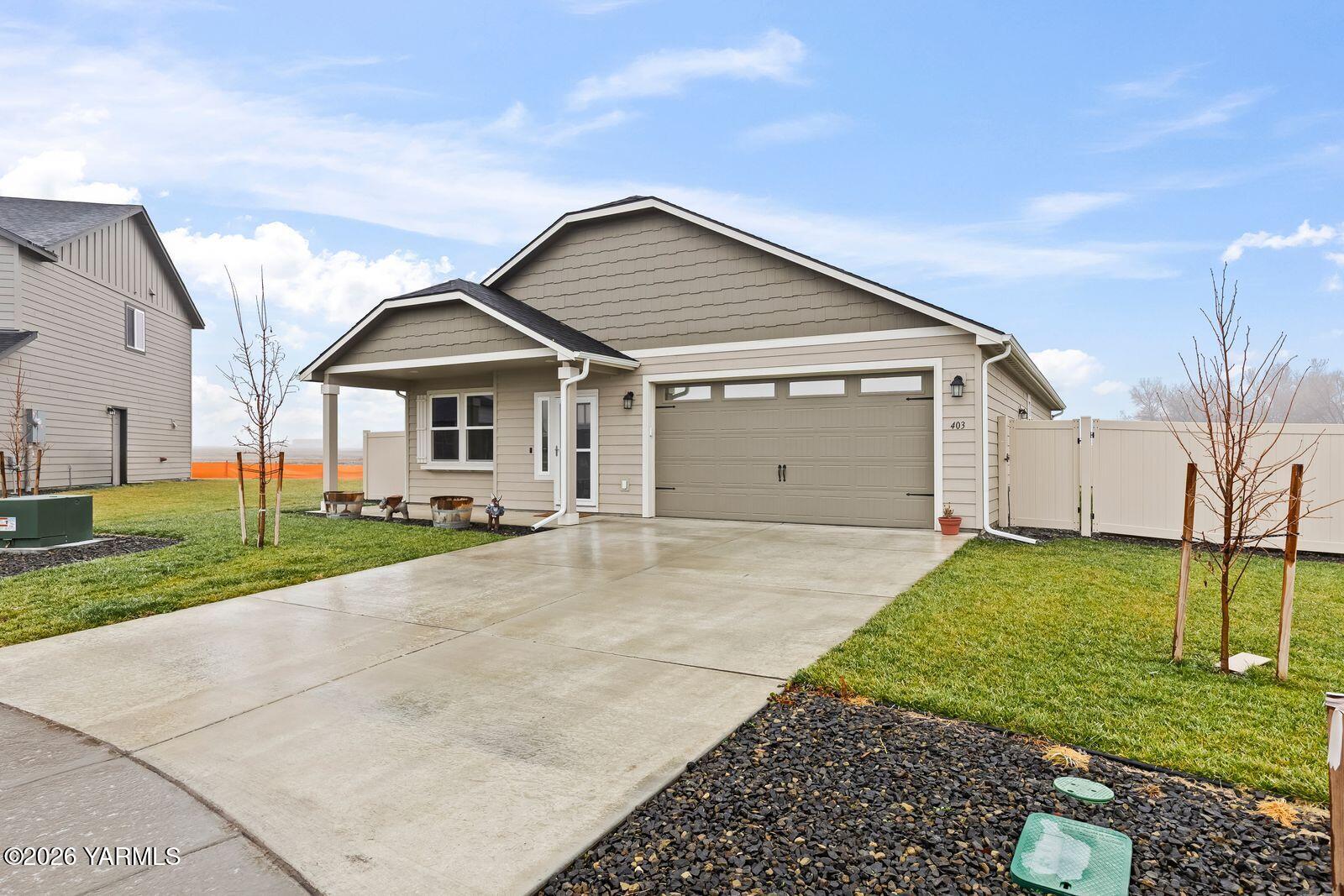 403 Lambert Court Grandview, WA 98930 - Photo 26 of 27 a view of a house with a yard