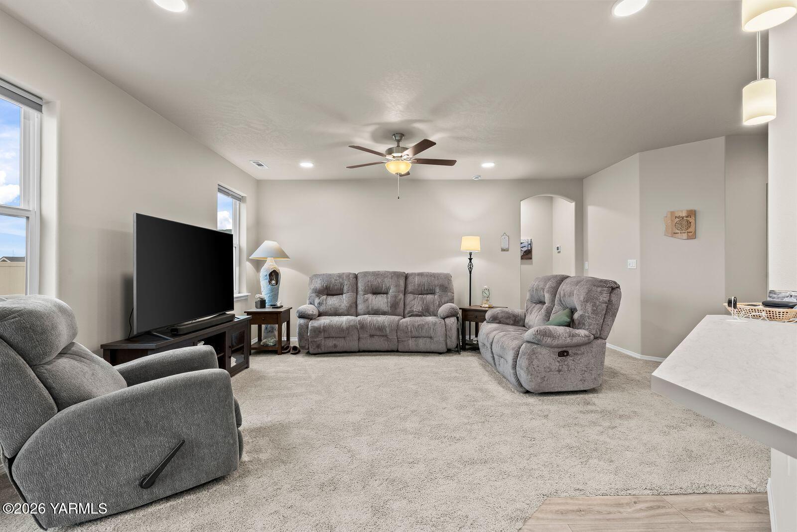 403 Lambert Court Grandview, WA 98930 - Photo 6 of 27 a living room with furniture and a flat screen tv