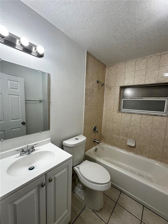 1907 Rio Grande Avenue Orlando, FL 32805 - Photo 12 of 17 a bathroom with a sink a toilet a mirror and shower