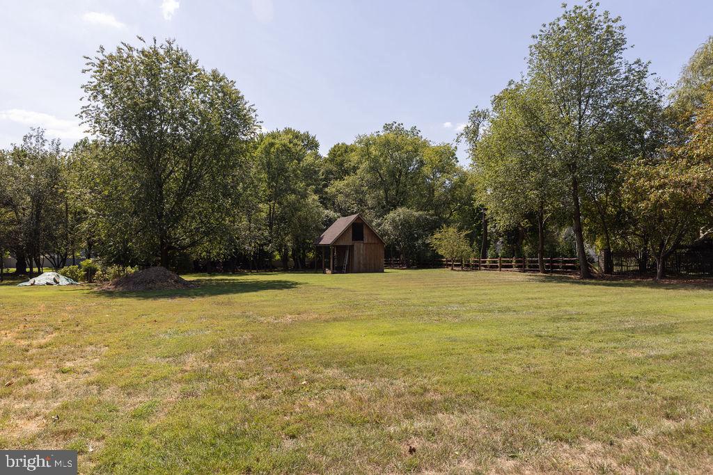 1613 Walton Road Blue Bell, PA 19422 - Photo 2 of 16 a view of a swimming pool and trees