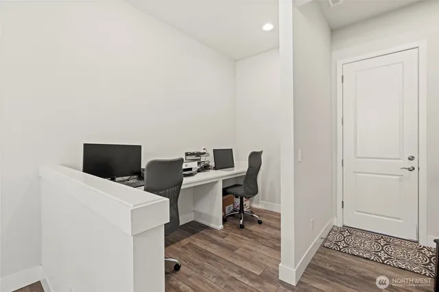 a view of a livingroom with furniture and windows