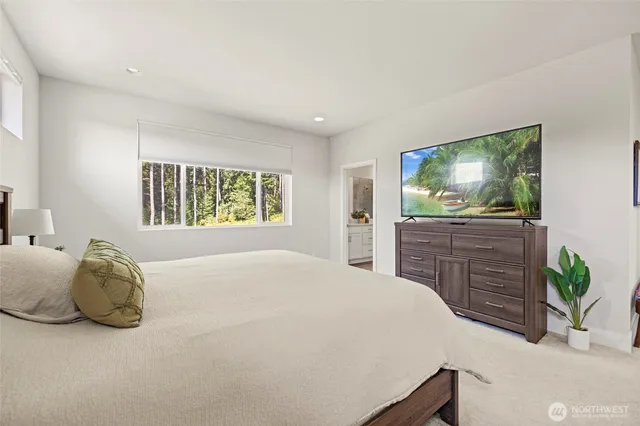 a bathroom with a double vanity sink mirror and shower