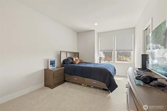 a bedroom with bed and a window