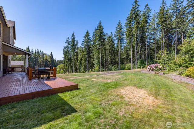 a view of a backyard with sitting area