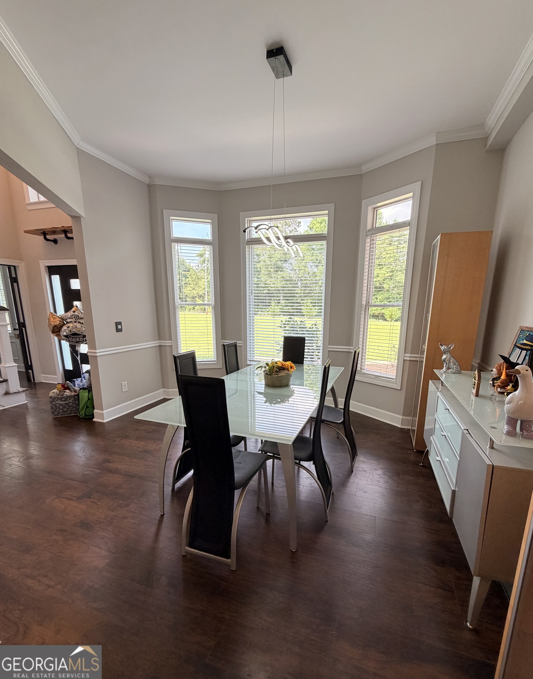 892 Perimeter Road Monticello, GA 31064 - Photo 6 of 38 a view of a dining room with furniture window and wooden floor