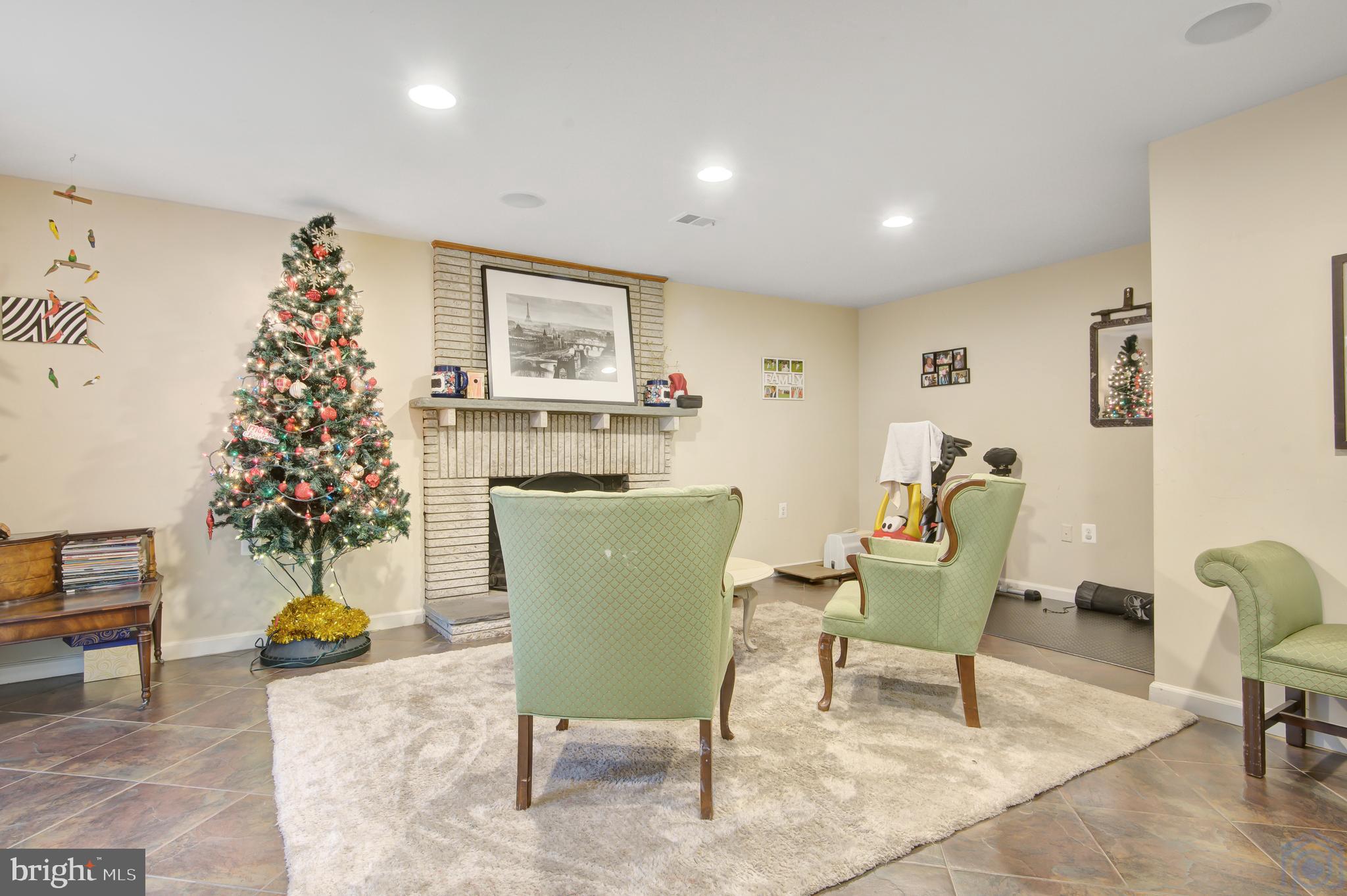 1002 La Grande Road Silver Spring, MD 20903 - Photo 26 of 33 Family Room w/ fireplace on mid-level.