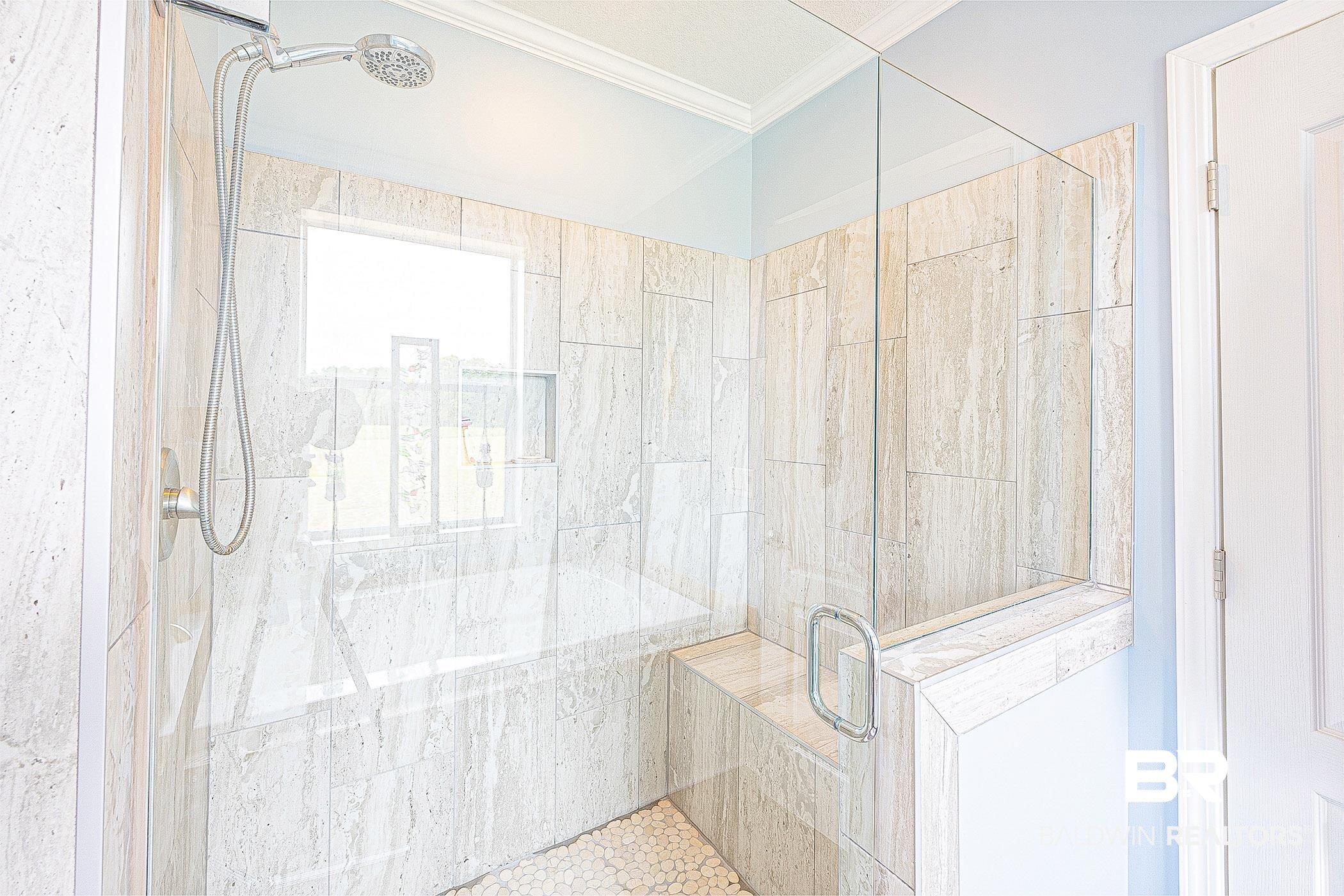 16000 John Bauer Road Summerdale, AL 36580 - Photo 22 of 34 Bathroom featuring ornamental molding and a shower stall