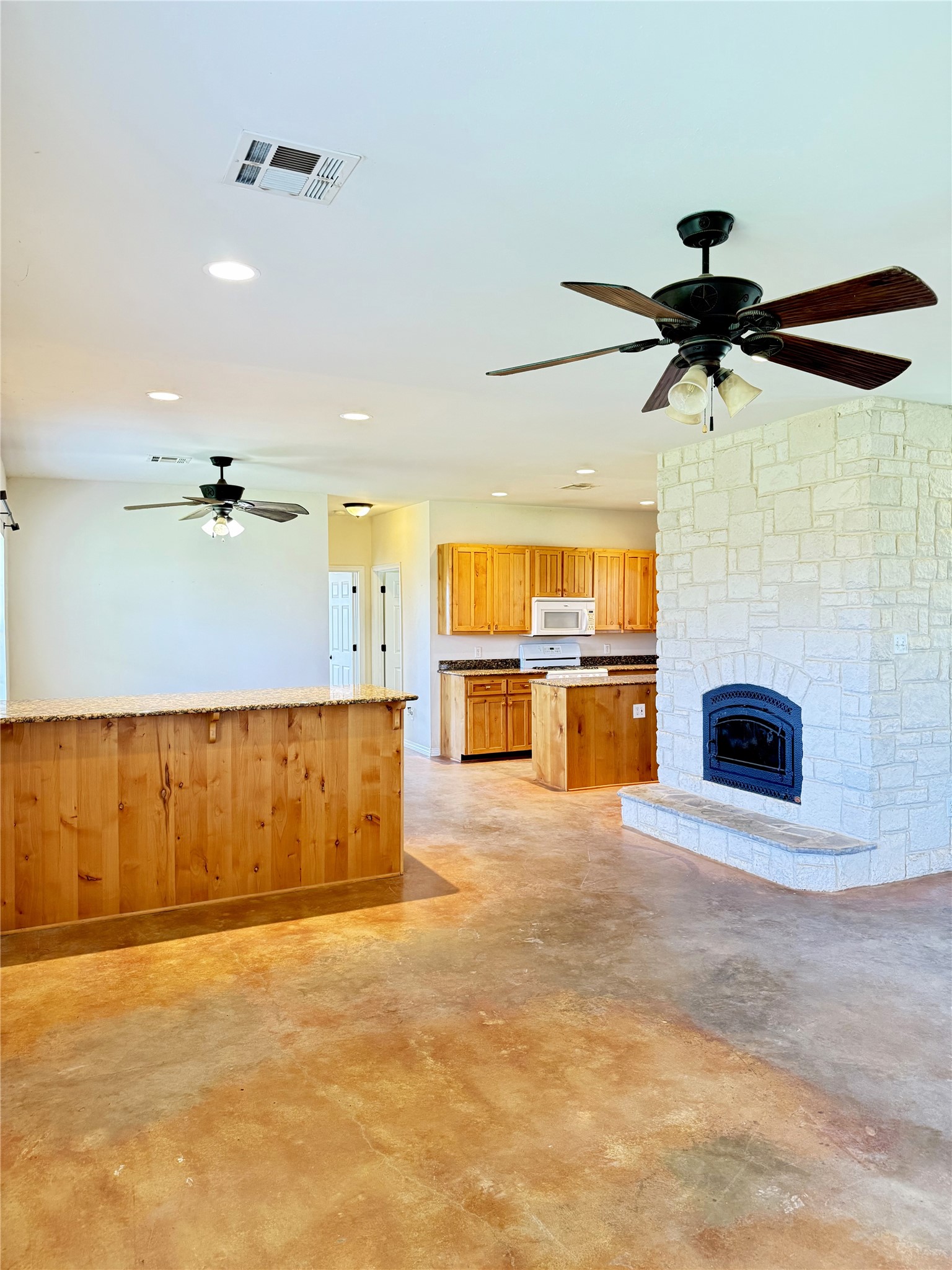 11791 Silver Springs Road Rockdale, TX 76567 - Photo 13 of 28 a view of a kitchen and a windows a ceiling fan