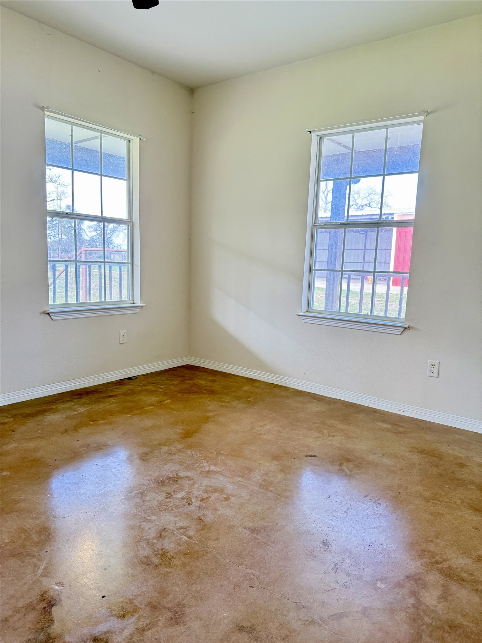 11791 Silver Springs Road Rockdale, TX 76567 - Photo 16 of 28 an empty room with a empty space and windows