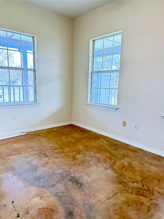 11791 Silver Springs Road Rockdale, TX 76567 - Photo 17 of 28 Unfurnished room featuring concrete flooring and healthy amount of natural light
