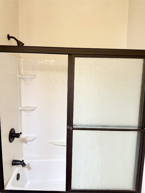 11791 Silver Springs Road Rockdale, TX 76567 - Photo 18 of 28 Full bathroom with shower / bath combination with glass door