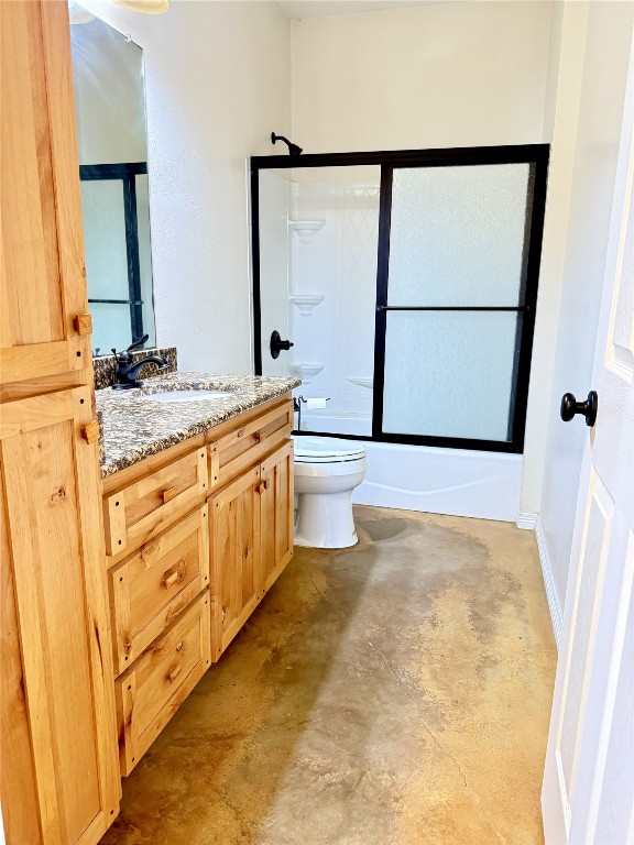 11791 Silver Springs Road Rockdale, TX 76567 - Photo 21 of 28 Full bathroom with vanity, concrete flooring, and bath / shower combo with glass door