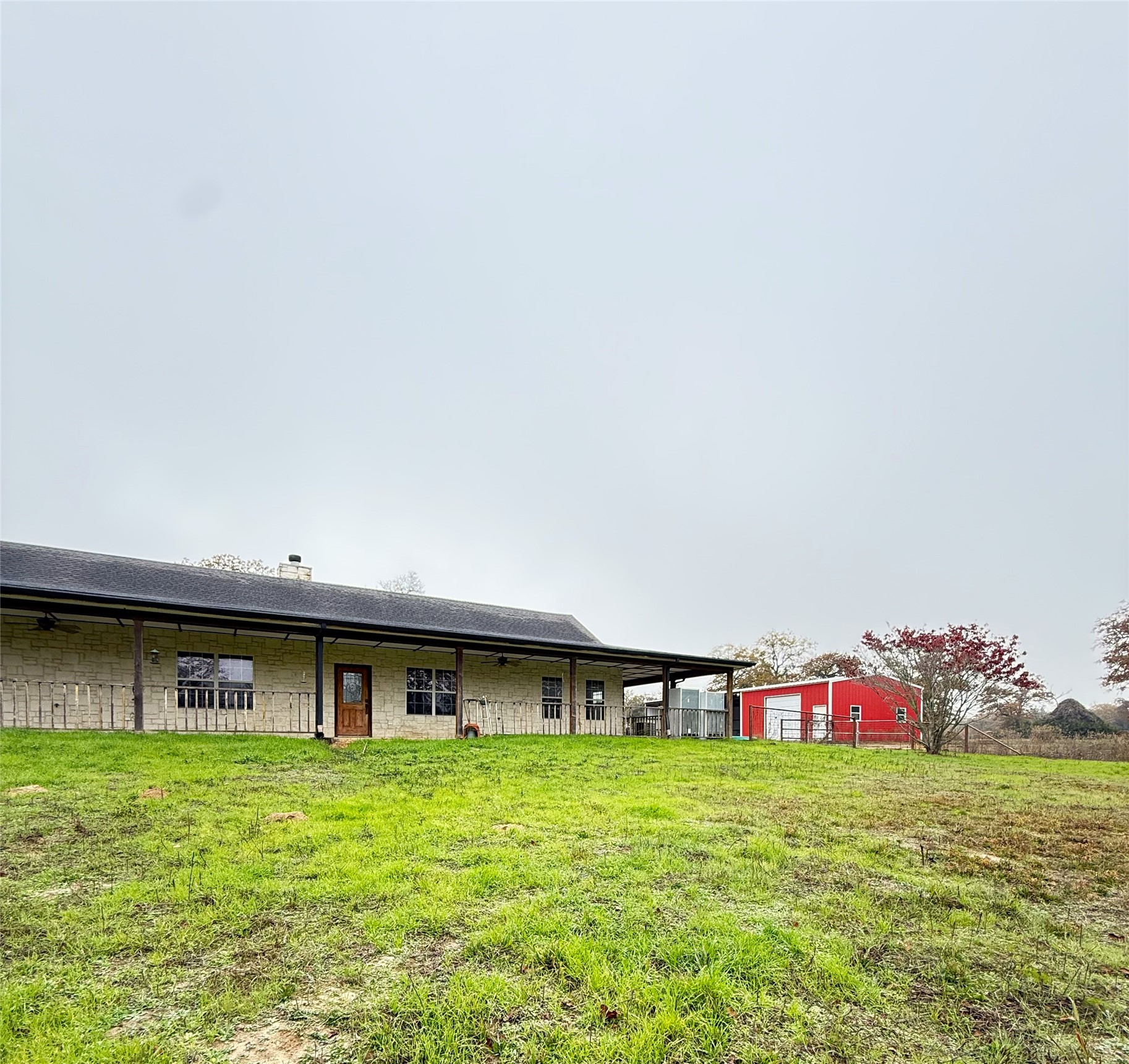 11791 Silver Springs Road Rockdale, TX 76567 - Photo 5 of 28 a front view of a house with garden