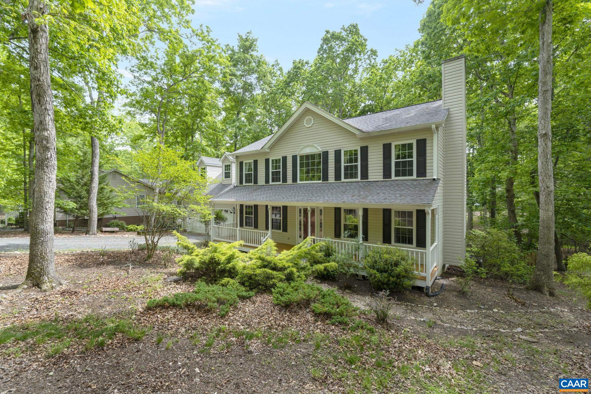 42 Oak Grove Road Palmyra, VA 22963 - Photo 1 of 37 a front view of a house with a garden