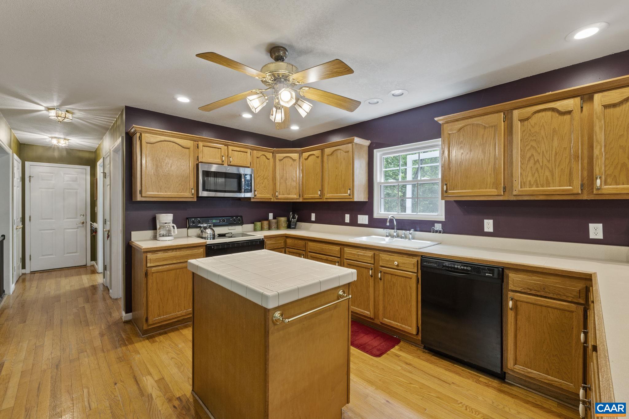 42 Oak Grove Road Palmyra, VA 22963 - Photo 14 of 37 a kitchen with a sink appliances cabinets and a large window