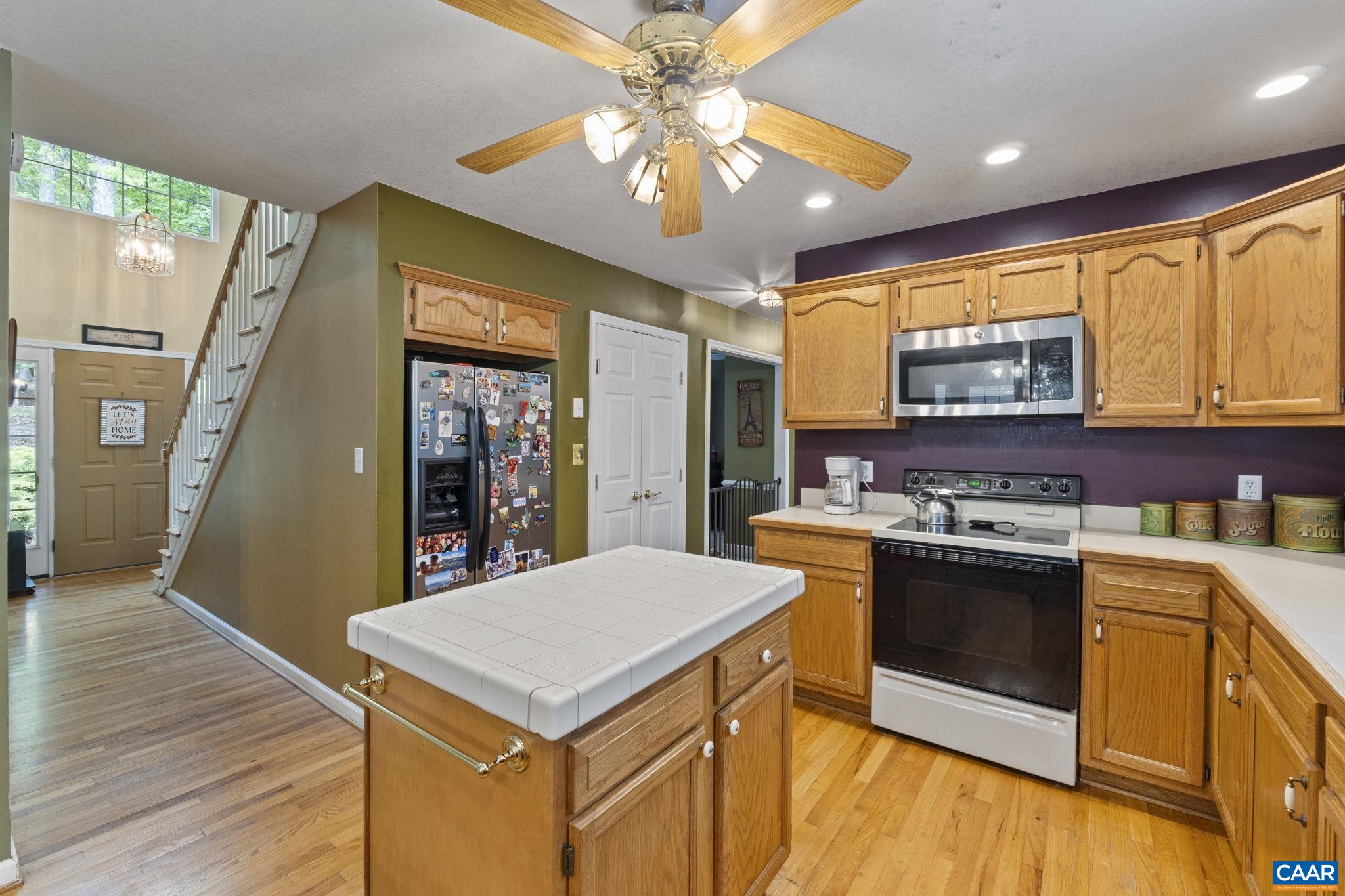42 Oak Grove Road Palmyra, VA 22963 - Photo 15 of 37 a kitchen with a stove a sink dishwasher and a refrigerator