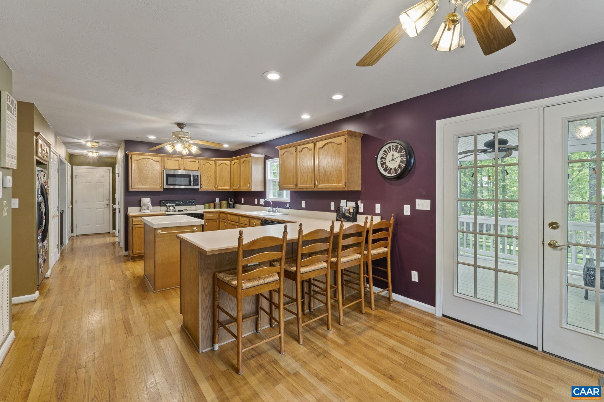 42 Oak Grove Road Palmyra, VA 22963 - Photo 17 of 37 a view of a dining room with furniture window and wooden floor