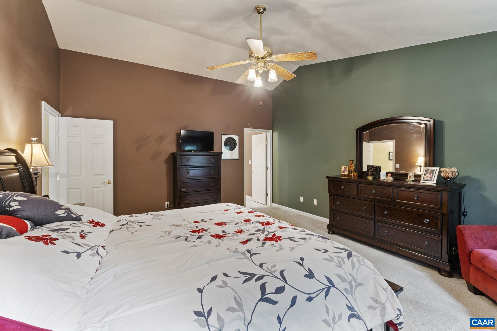42 Oak Grove Road Palmyra, VA 22963 - Photo 29 of 37 a bedroom with a bed and a mirror on dresser