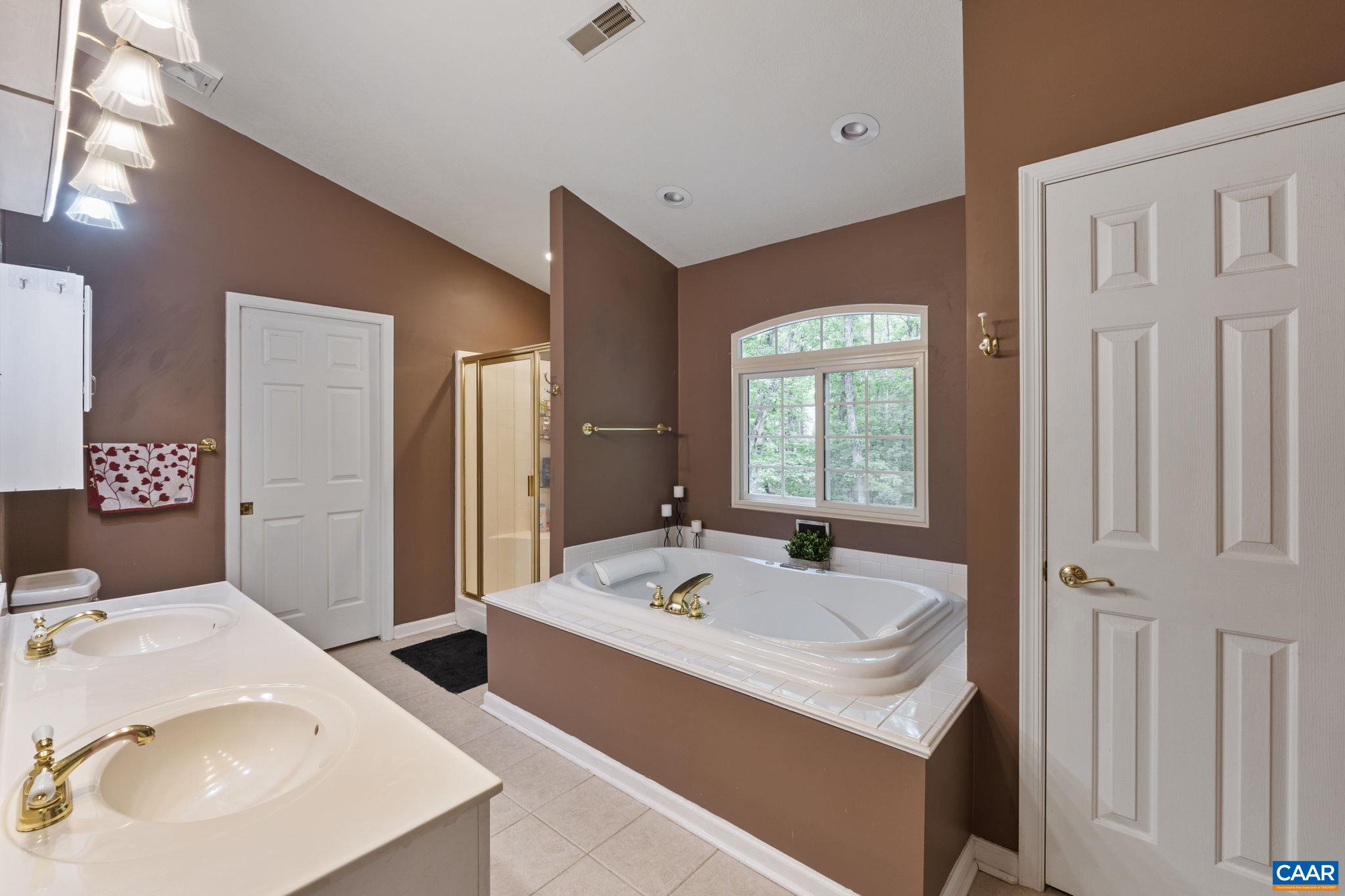 42 Oak Grove Road Palmyra, VA 22963 - Photo 30 of 37 a bathroom with 2 sink and a mirror