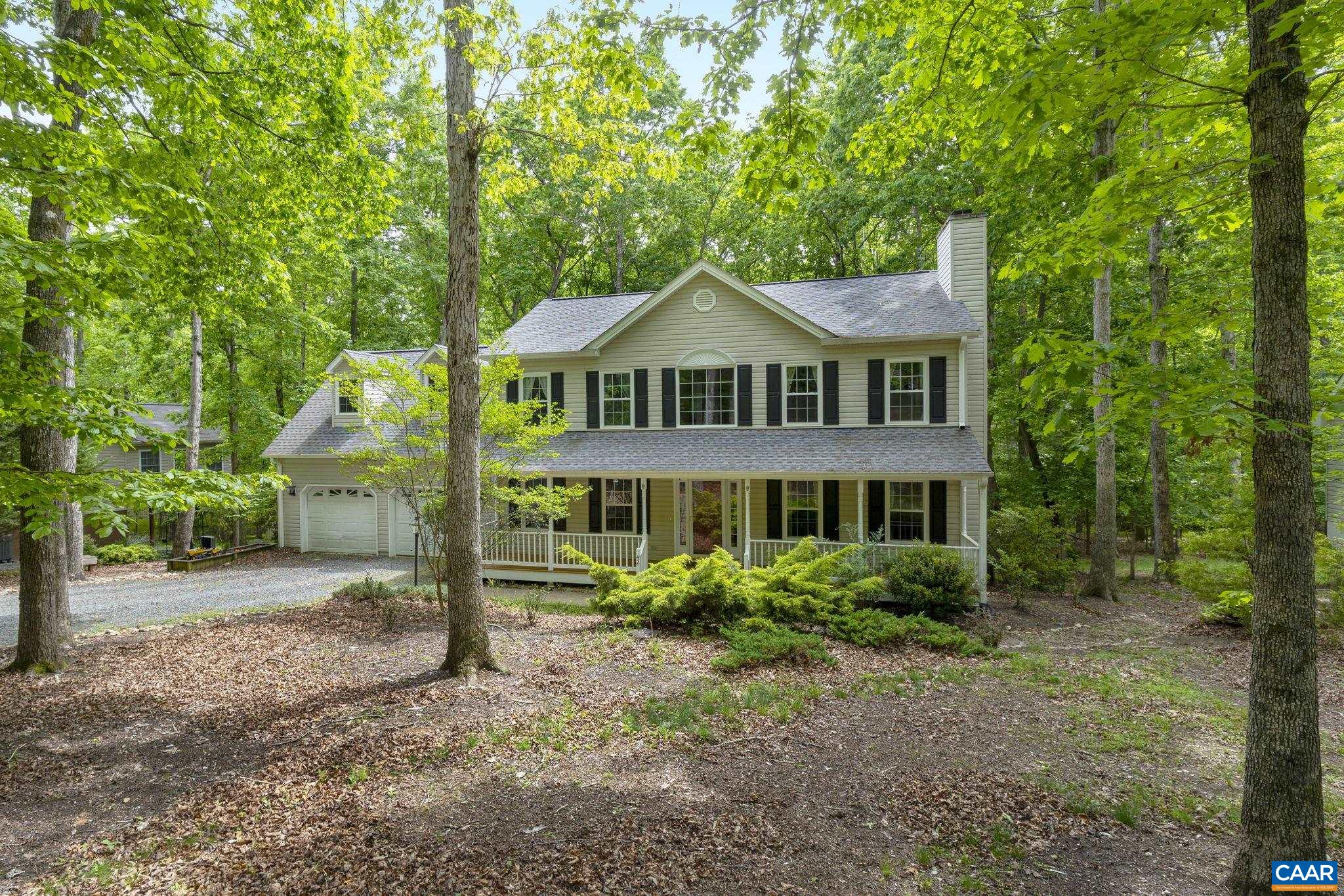 42 Oak Grove Road Palmyra, VA 22963 - Photo 32 of 37 a front view of a house with a garden
