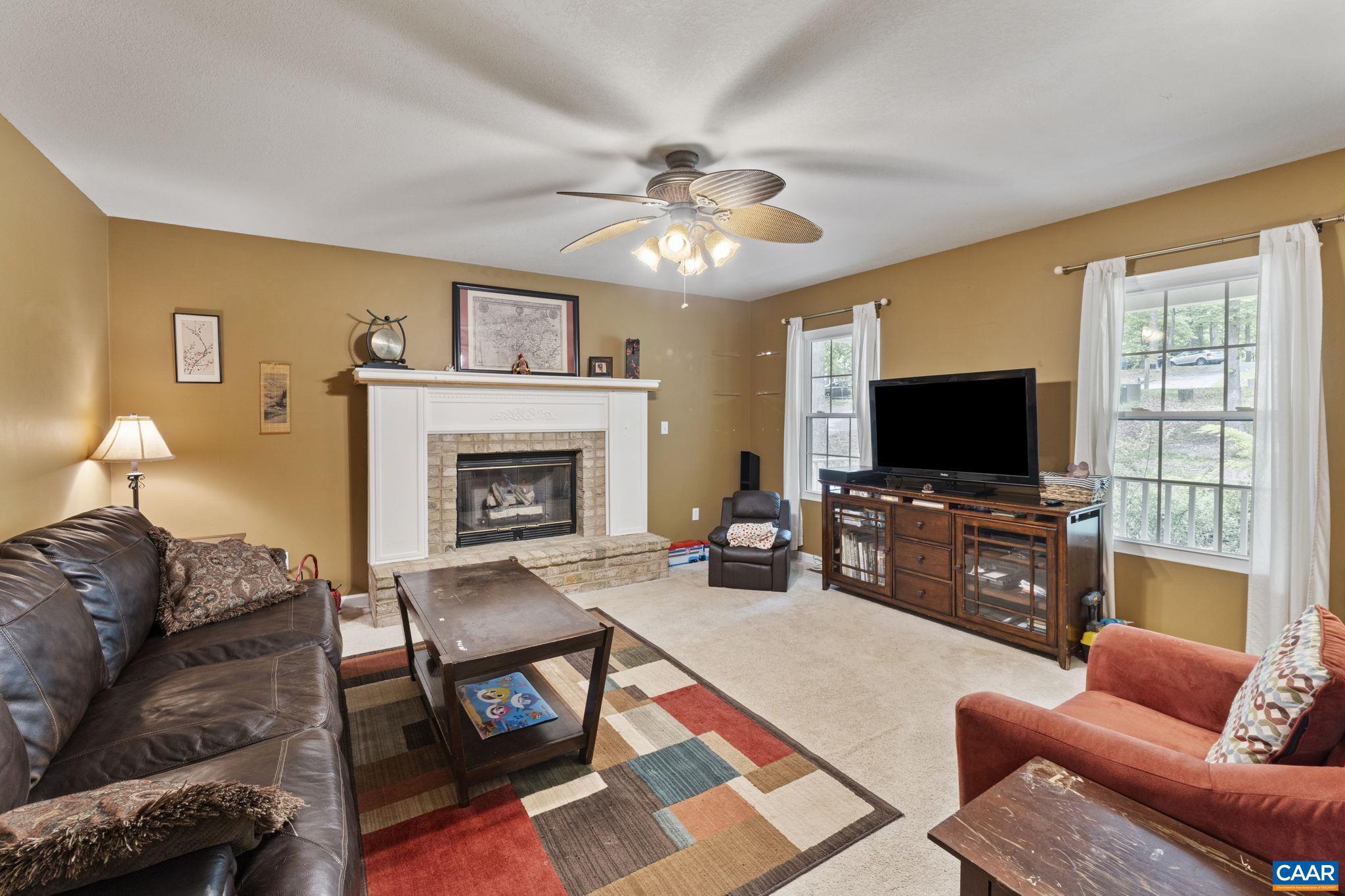 42 Oak Grove Road Palmyra, VA 22963 - Photo 8 of 37 a living room with furniture and a flat screen tv