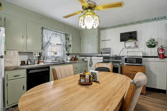a kitchen with a table and chairs in it