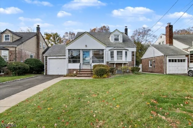 a view of a house with a yard and plants