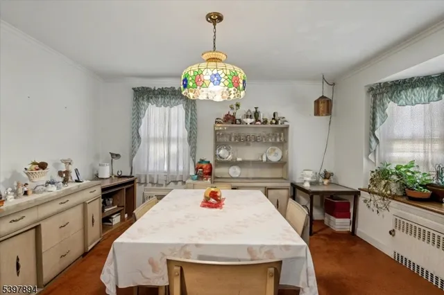 a very nice looking dining room with a table and chairs in it