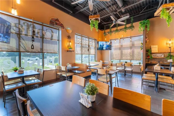 a very nice looking dining room with a large window