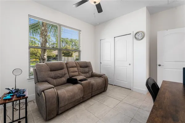 a living room with furniture and a large window