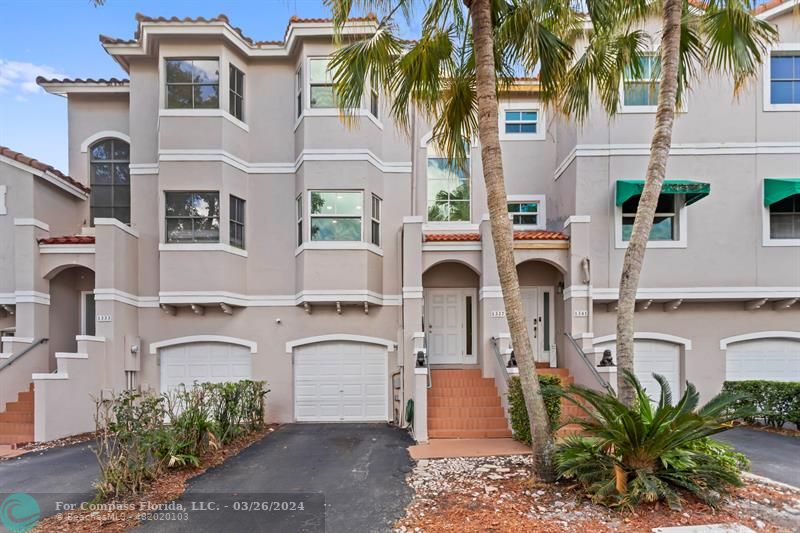 1337 Northwest 126th Way, Unit 1337 Sunrise, FL 33323 - Photo 1 of 63 a front view of multiple houses with yard