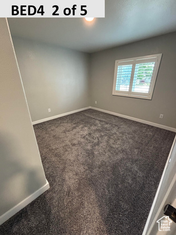 335 Memorial Park Road Henefer, UT 84033 - Photo 22 of 51 Bedroom 4 featuring dark colored carpet and baseboards