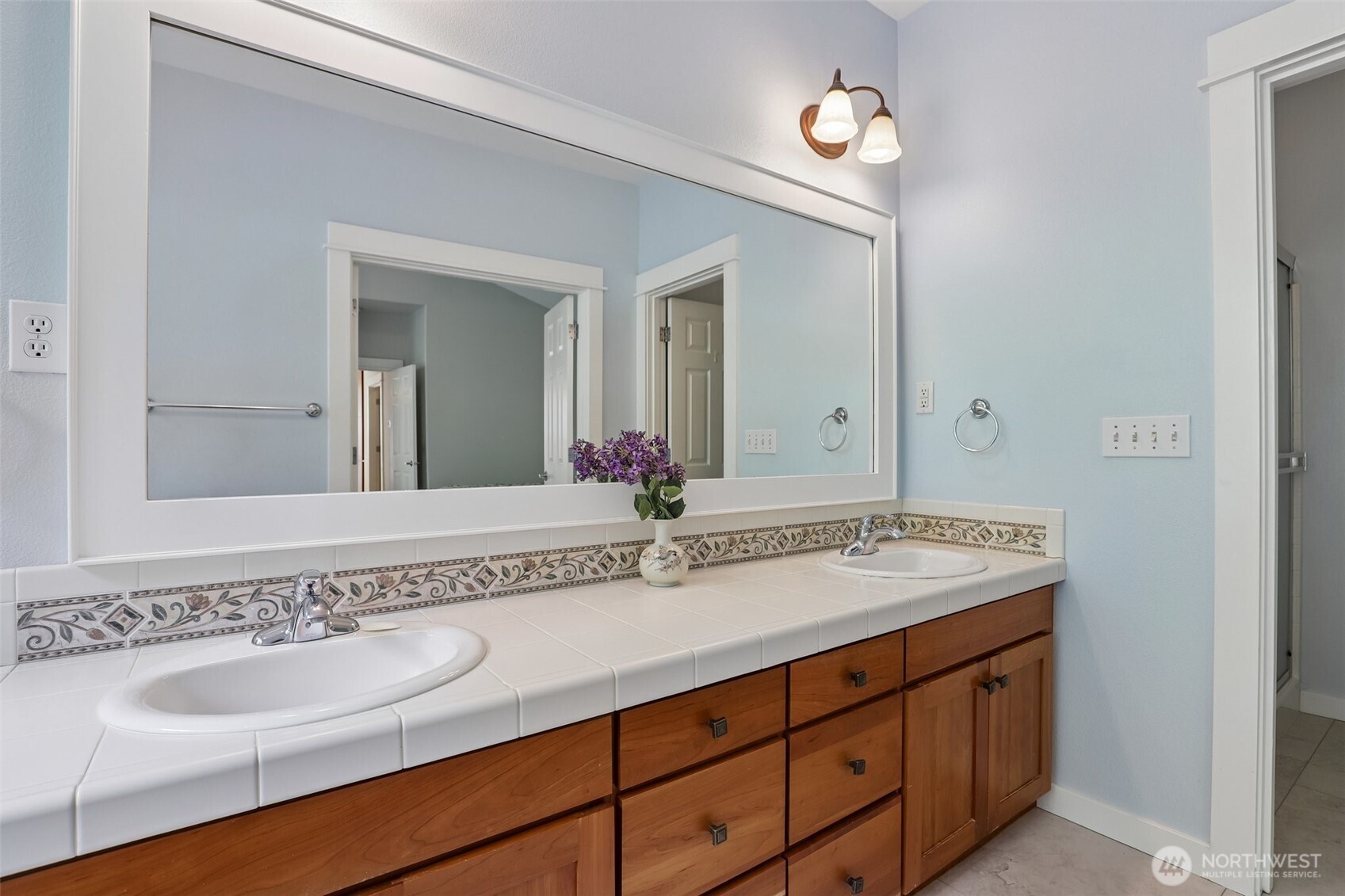 19709 Southeast 26th Way Camas, WA 98607 - Photo 25 of 36 a bathroom with a granite countertop sink and a mirror