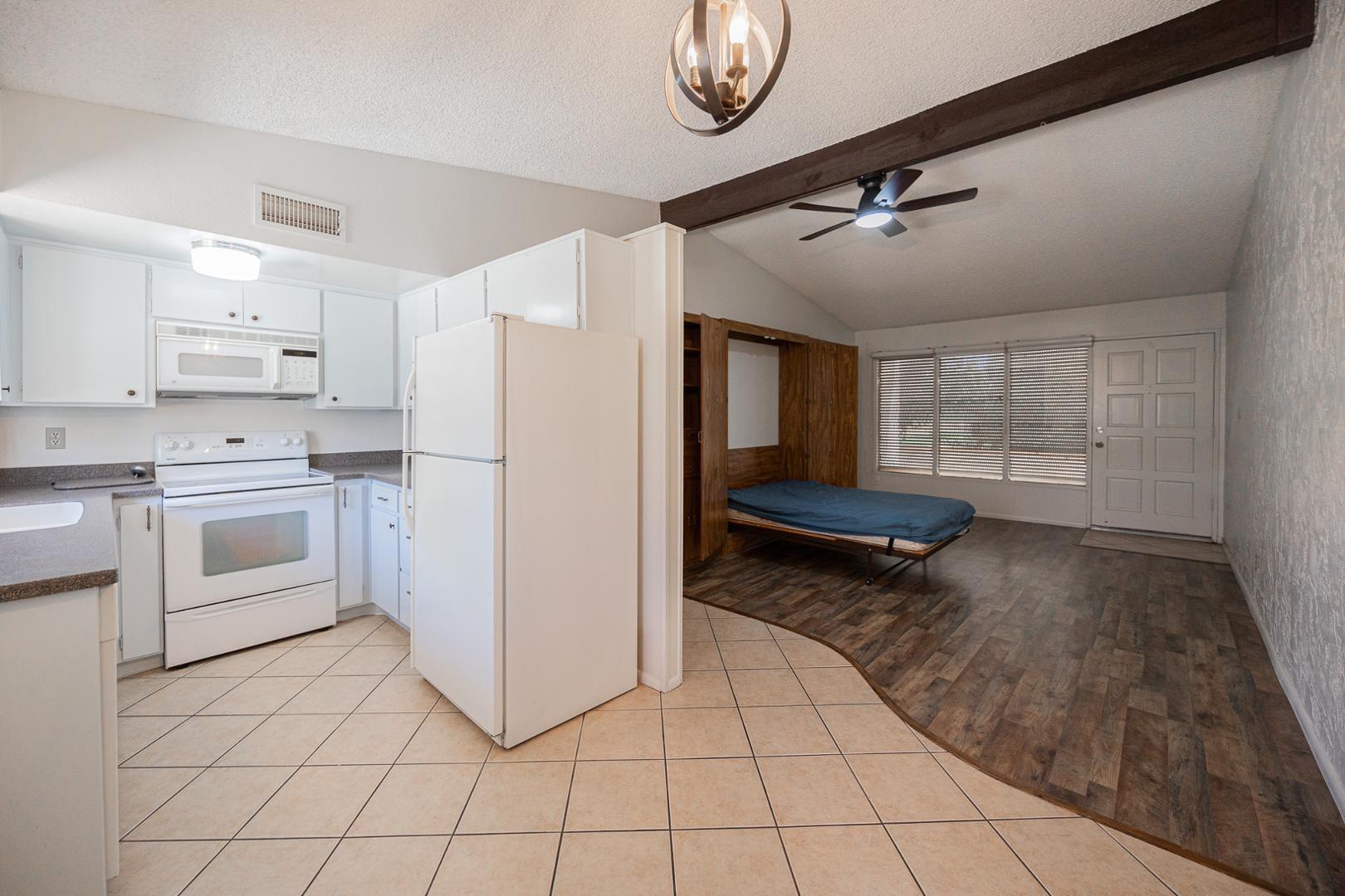 609 South Power Road, Unit 338 Mesa, AZ 85206 - Photo 15 of 24 a kitchen with white cabinets and white appliances