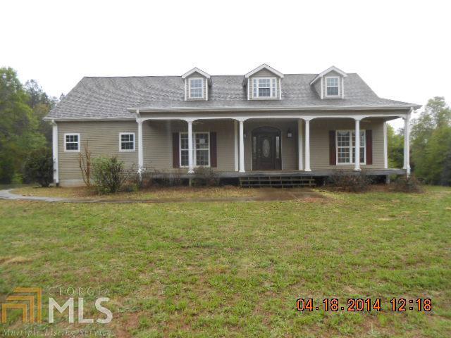 1867 West Fossett Road Concord, GA 30206 - Photo 1 of 1 a front view of a house with garden